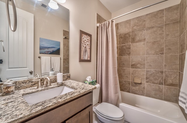 full bathroom with toilet, shower / tub combo with curtain, and vanity