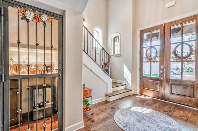 entrance foyer featuring hardwood / wood-style floors and french doors