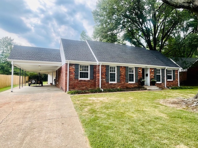 ranch-style house featuring a carport and a front yard