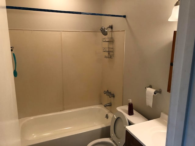 full bathroom featuring tub / shower combination, vanity, and toilet