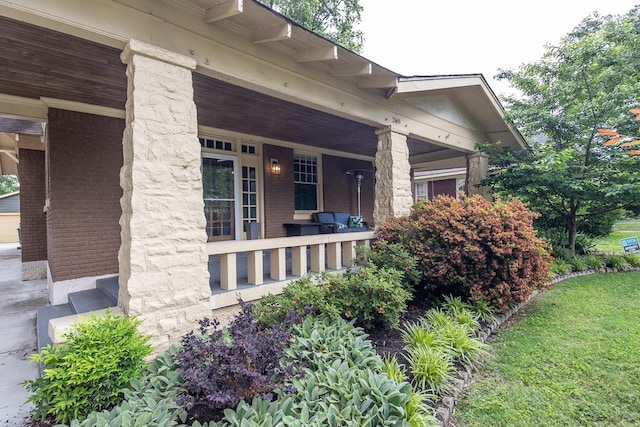 view of side of home featuring a porch