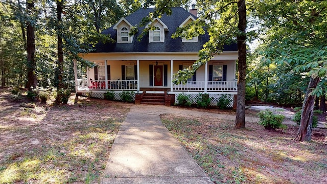 view of front of house featuring a porch and a shingled roof