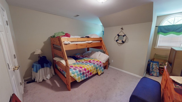 bedroom featuring carpet floors, visible vents, and baseboards