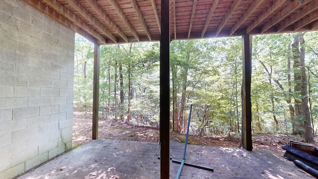 view of patio / terrace featuring a view of trees