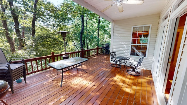 wooden deck featuring a ceiling fan