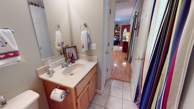 bathroom featuring vanity, toilet, and tile patterned floors