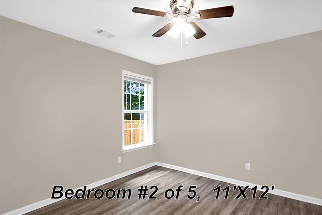 unfurnished room with ceiling fan and wood-type flooring