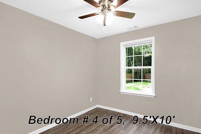 empty room featuring hardwood / wood-style floors and ceiling fan