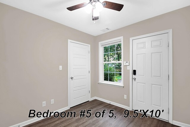 interior space with dark hardwood / wood-style flooring and ceiling fan