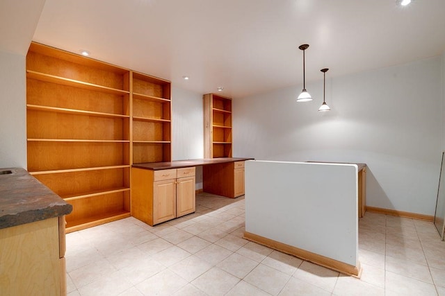 unfurnished office with light tile patterned floors, baseboards, and recessed lighting