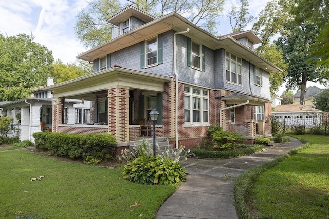 view of property exterior with a yard, a porch, and brick siding