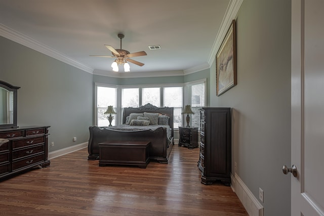 bedroom featuring ceiling fan, dark hardwood / wood-style floors, and ornamental molding