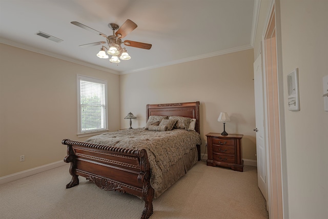 carpeted bedroom featuring ceiling fan and ornamental molding