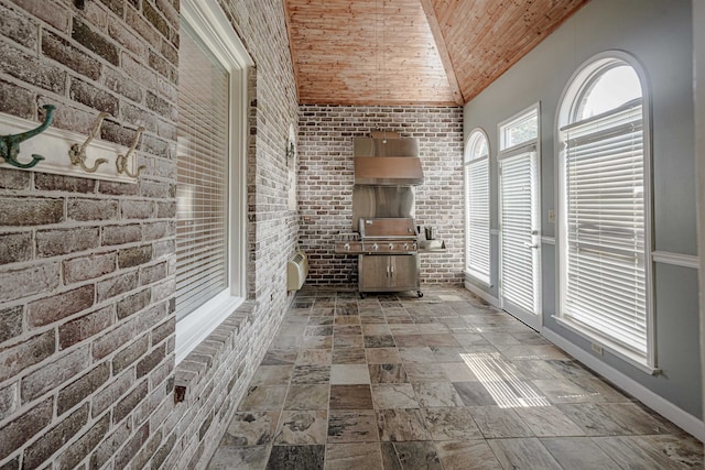 interior space with vaulted ceiling and wood ceiling