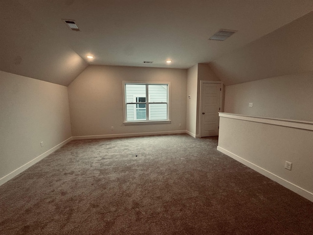 bonus room with lofted ceiling, carpet, visible vents, and baseboards