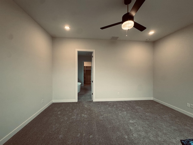 spare room with dark colored carpet, recessed lighting, visible vents, ceiling fan, and baseboards