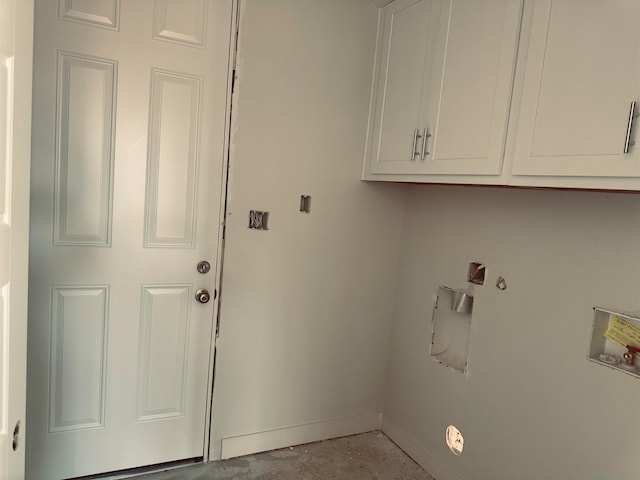 laundry room with hookup for a washing machine, cabinet space, and baseboards