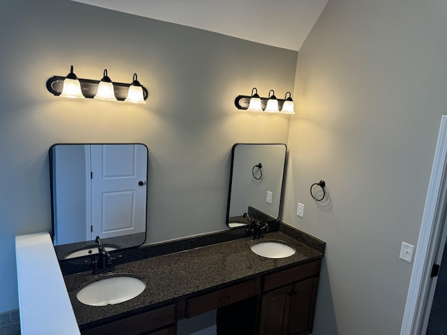 bathroom featuring double vanity and a sink