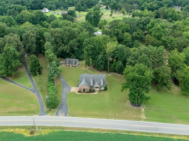 birds eye view of property with a rural view