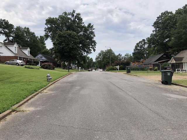 view of road featuring curbs