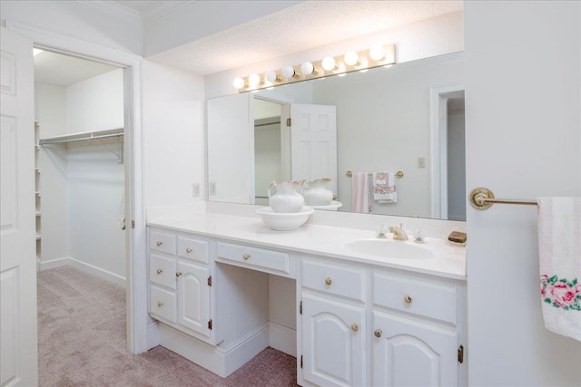 bathroom with a textured ceiling and vanity