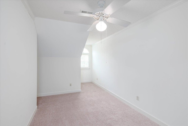 bonus room featuring a textured ceiling, carpet floors, ceiling fan, and vaulted ceiling