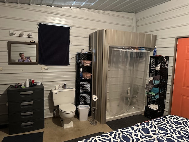 full bathroom featuring a walk in shower, concrete floors, and toilet