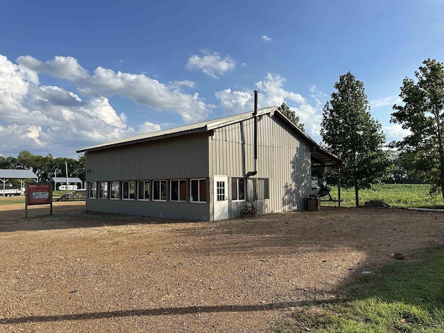 view of property exterior with a carport