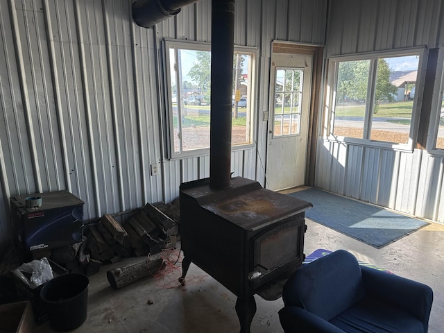 sunroom with a wood stove