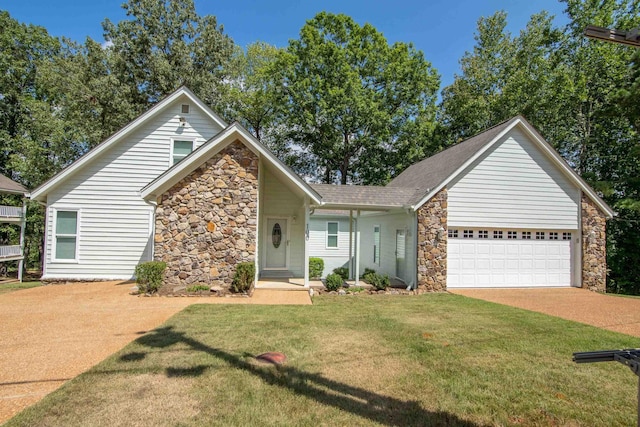100 Vantage Pt, Counce, TN 38326 - view of front facade with stone siding, a front yard, driveway, and a garage