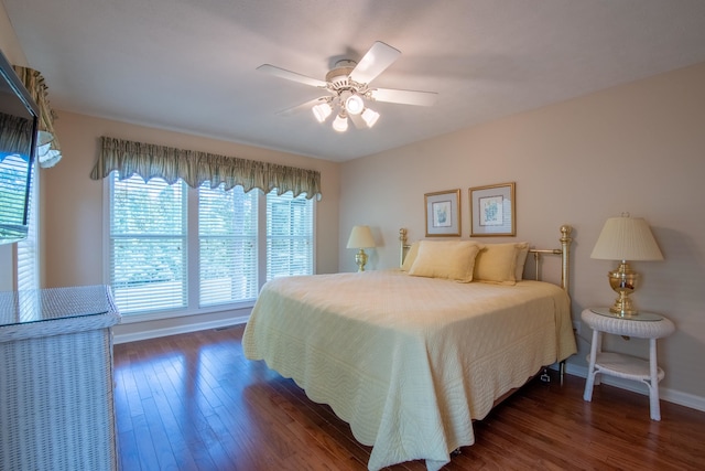 bedroom with ceiling fan and dark wood-type flooring