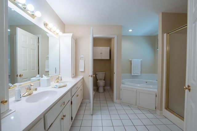 full bathroom featuring separate shower and tub, toilet, double vanity, and tile patterned floors