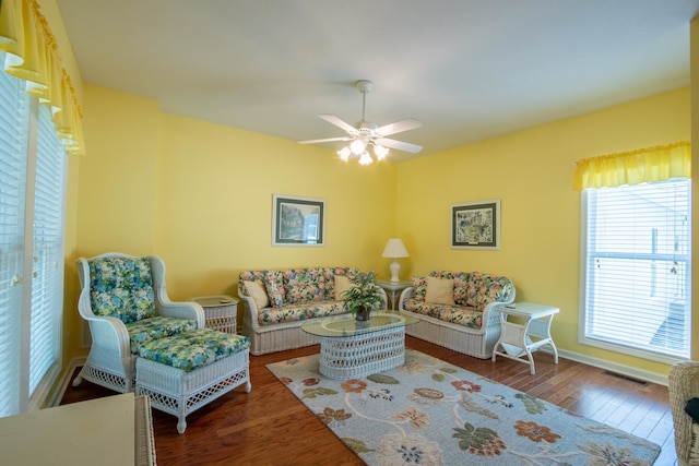 living room featuring hardwood / wood-style flooring and ceiling fan