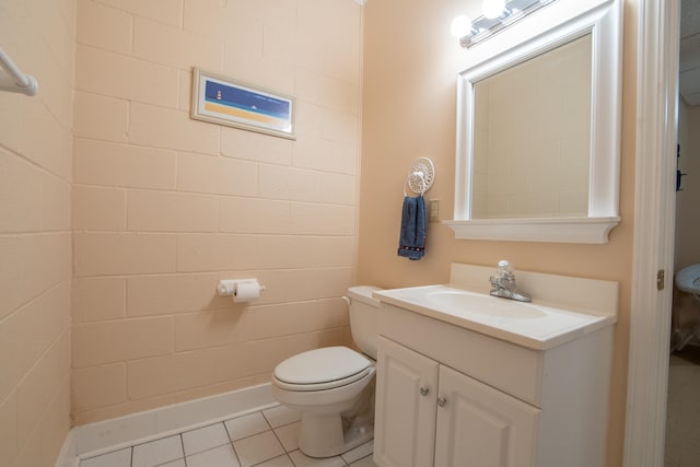 bathroom featuring tile patterned flooring, toilet, and vanity