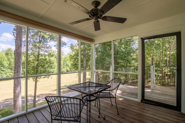 sunroom featuring ceiling fan and a healthy amount of sunlight