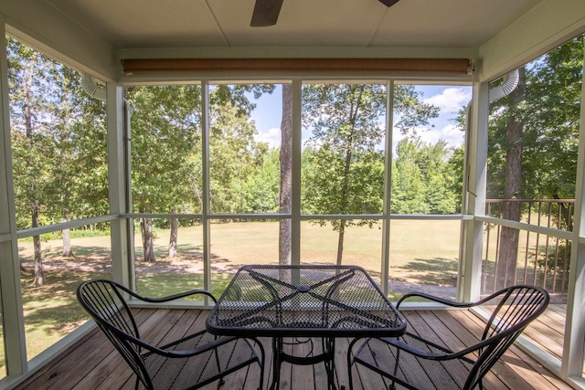 sunroom featuring ceiling fan