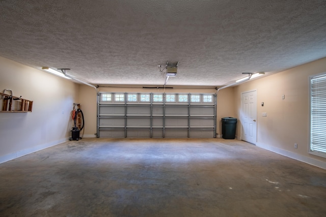 100 Vantage Pt, Counce, TN 38326 - garage with baseboards and a garage door opener