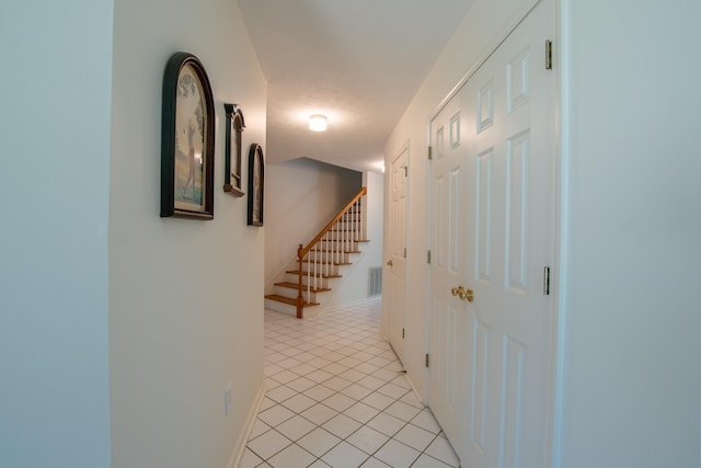100 Vantage Pt, Counce, TN 38326 - hallway with stairs, visible vents, baseboards, and light tile patterned floors