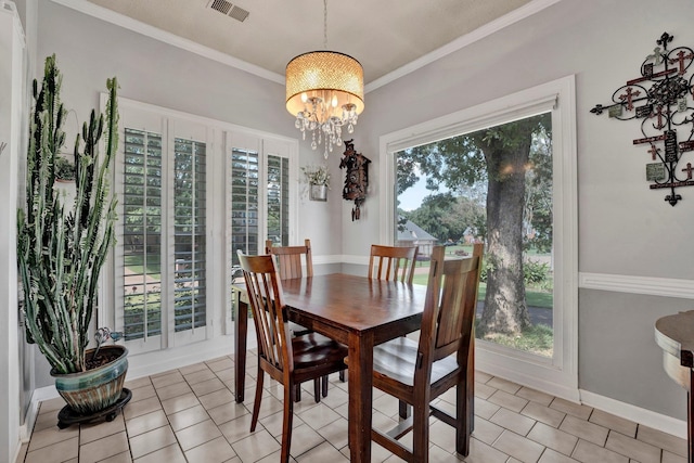 tiled dining area featuring an inviting chandelier, crown molding, and a healthy amount of sunlight