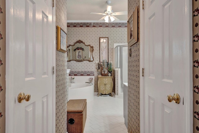 bathroom with ceiling fan and tile patterned flooring