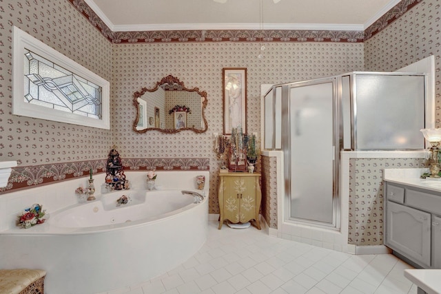 bathroom with tile patterned flooring, independent shower and bath, ornamental molding, and vanity