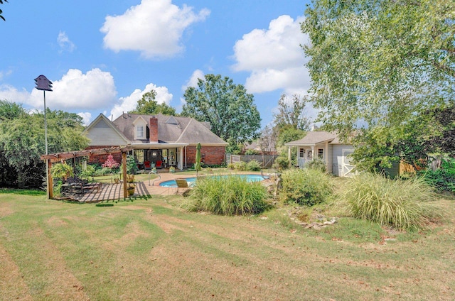 view of yard with a pergola, a patio, and a shed