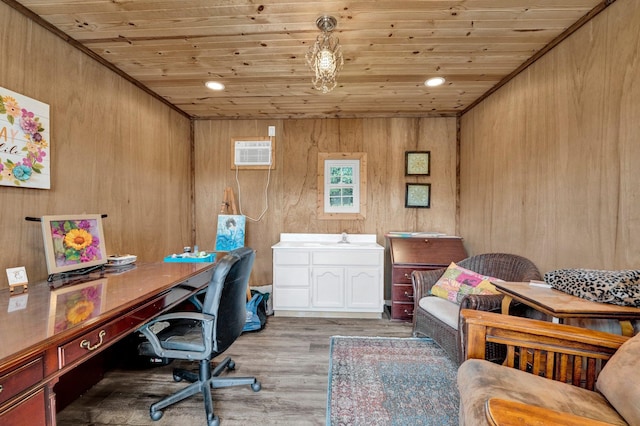 office space with a wall mounted AC, light wood-type flooring, wood walls, and wooden ceiling