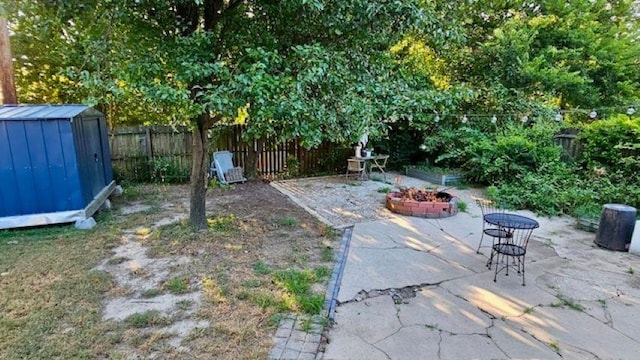 view of patio / terrace with a storage shed