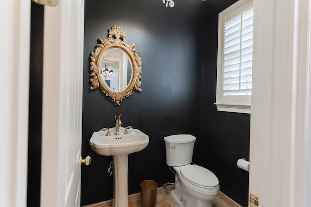 bathroom with tile patterned flooring and toilet