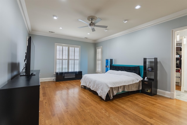 bedroom with ceiling fan, light hardwood / wood-style flooring, and crown molding