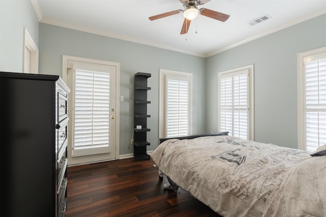 bedroom with ceiling fan, multiple windows, and dark hardwood / wood-style floors