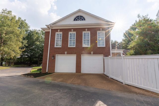 view of side of property featuring a garage