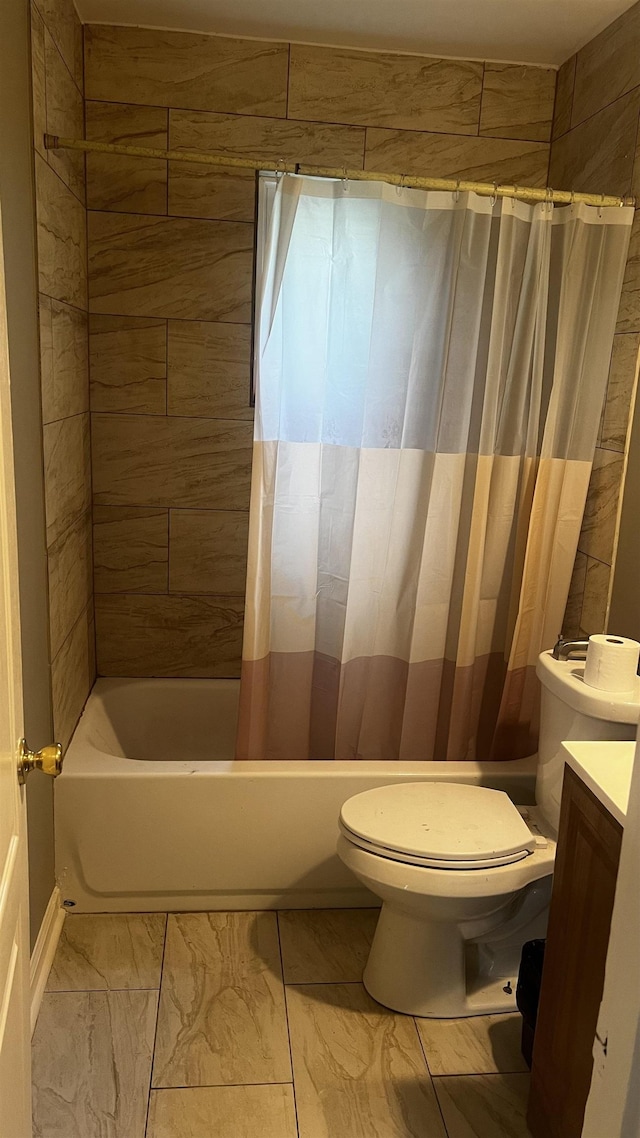 bathroom featuring shower / bath combination with curtain, toilet, and vanity