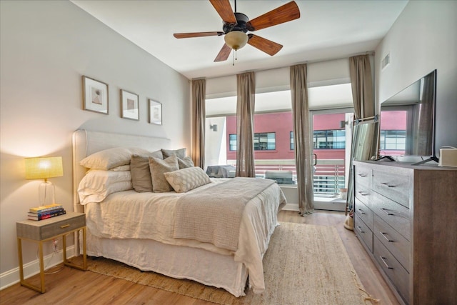 bedroom with ceiling fan and light wood-type flooring